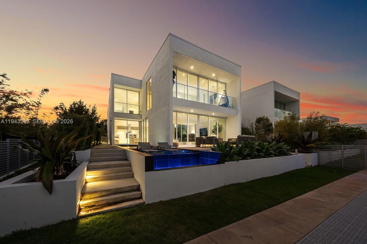 1011 West 48th Street Miami Beach, FL 33140 - Photo 41 of 44 a front view of a house with a yard