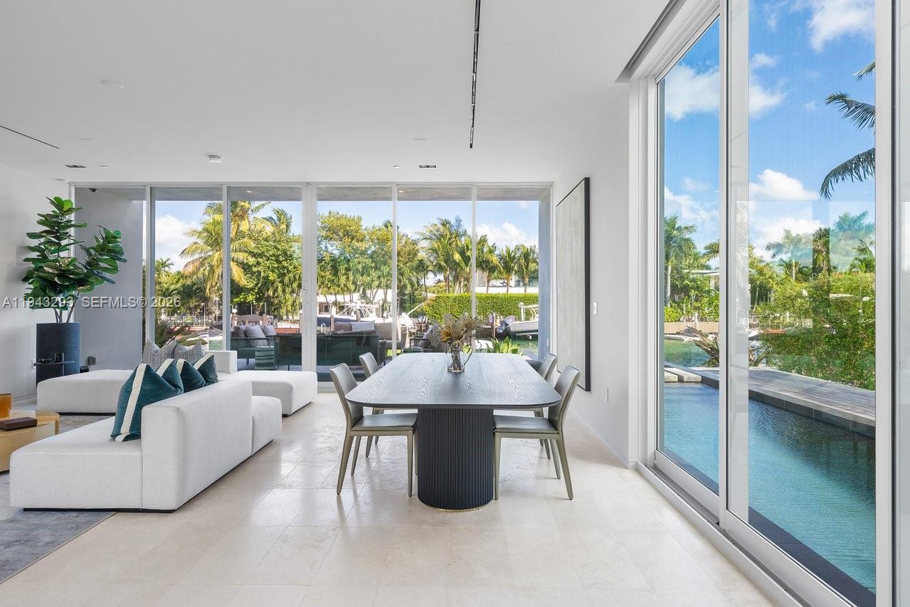 1011 West 48th Street Miami Beach, FL 33140 - Photo 9 of 44 a living room with furniture and a large window