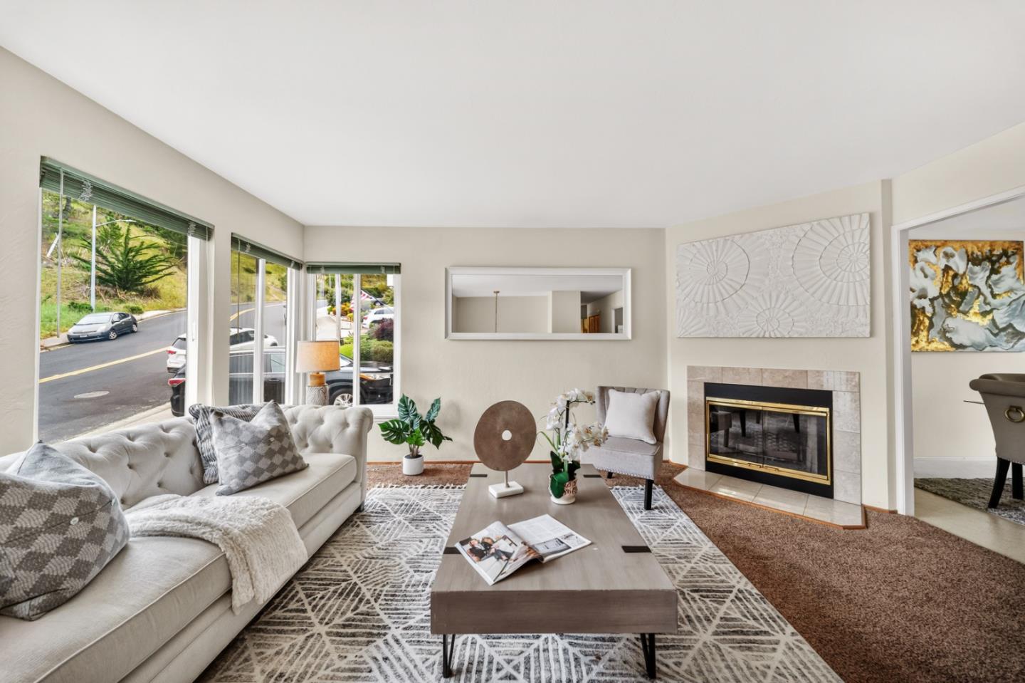 1287 Lerida Way Pacifica, CA 94044 - Photo 21 of 52 a living room with furniture a fireplace and a large window
