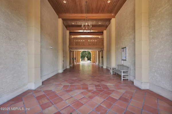 a living room with furniture a flat screen tv and a large window