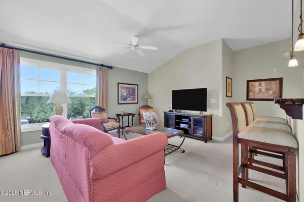 a view of a dining room with furniture window and outside view