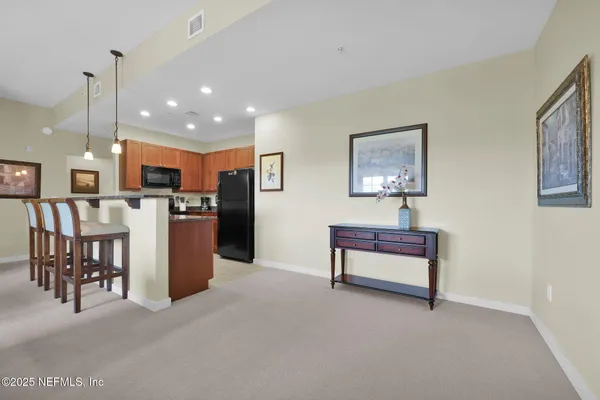a kitchen with a refrigerator sink and microwave