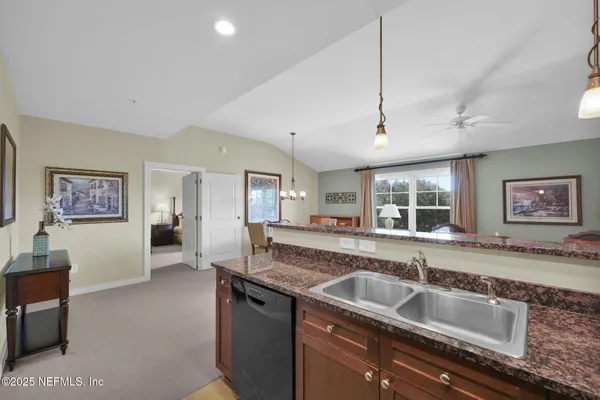 an aerial view of a house with garden space and a street view