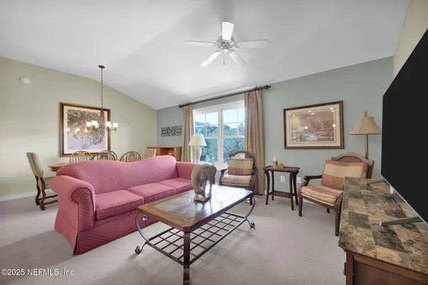 a large kitchen with a table and chairs