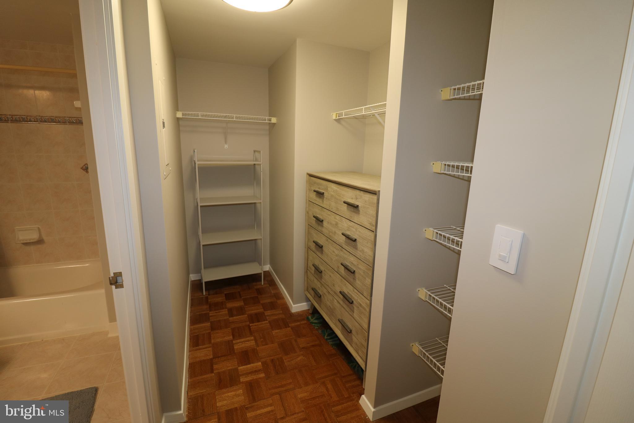 7111 Woodmont Avenue, Unit 415 Bethesda, MD 20815 - Photo 7 of 10 a bathroom with a shower and a sink