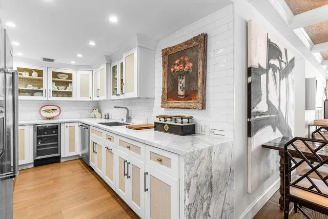 a kitchen with stainless steel appliances granite countertop a stove and a microwave
