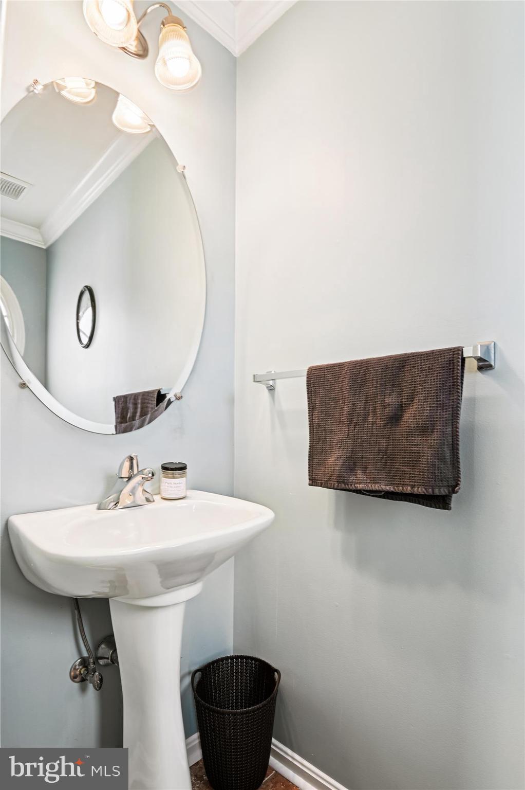 2310 228th Street Pasadena, MD 21122 - Photo 12 of 45 a bathroom with a sink and a mirror
