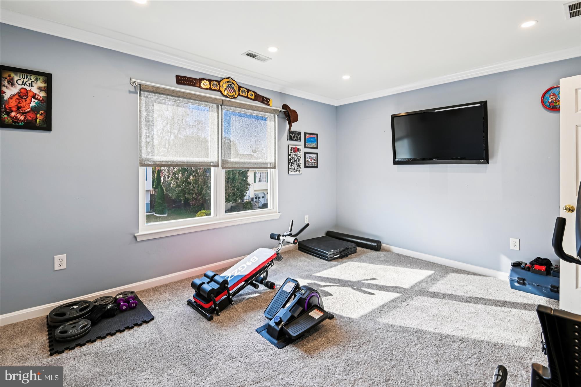 2310 228th Street Pasadena, MD 21122 - Photo 21 of 45 a room with gym equipment and a flat screen tv