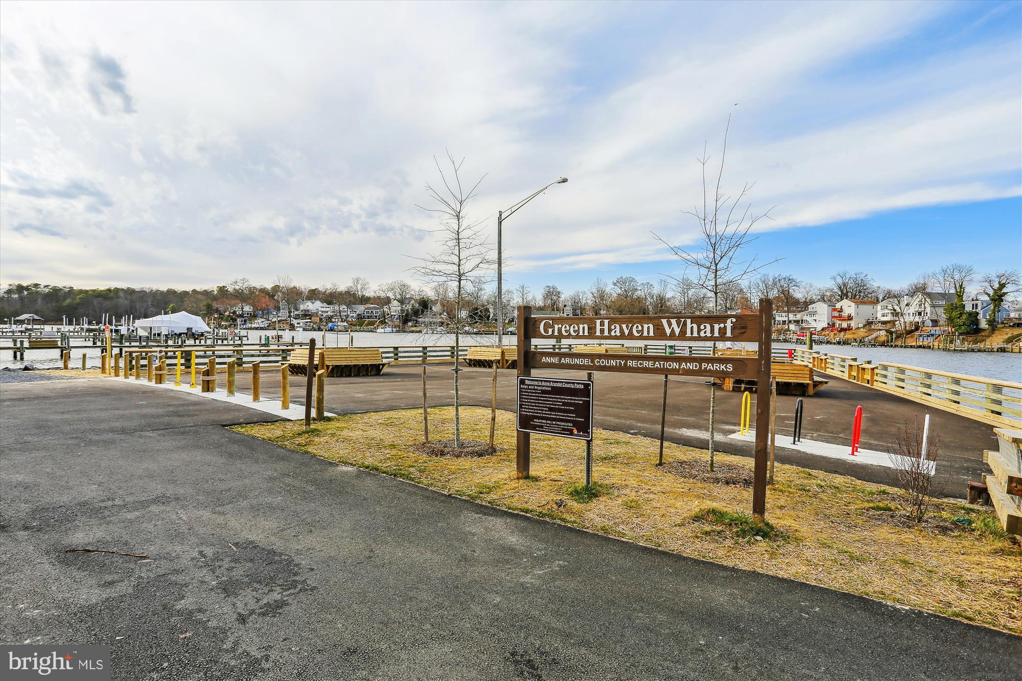 2310 228th Street Pasadena, MD 21122 - Photo 38 of 45 a view of a terrace with wooden benches