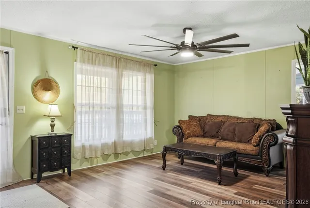 a living room with furniture and a window