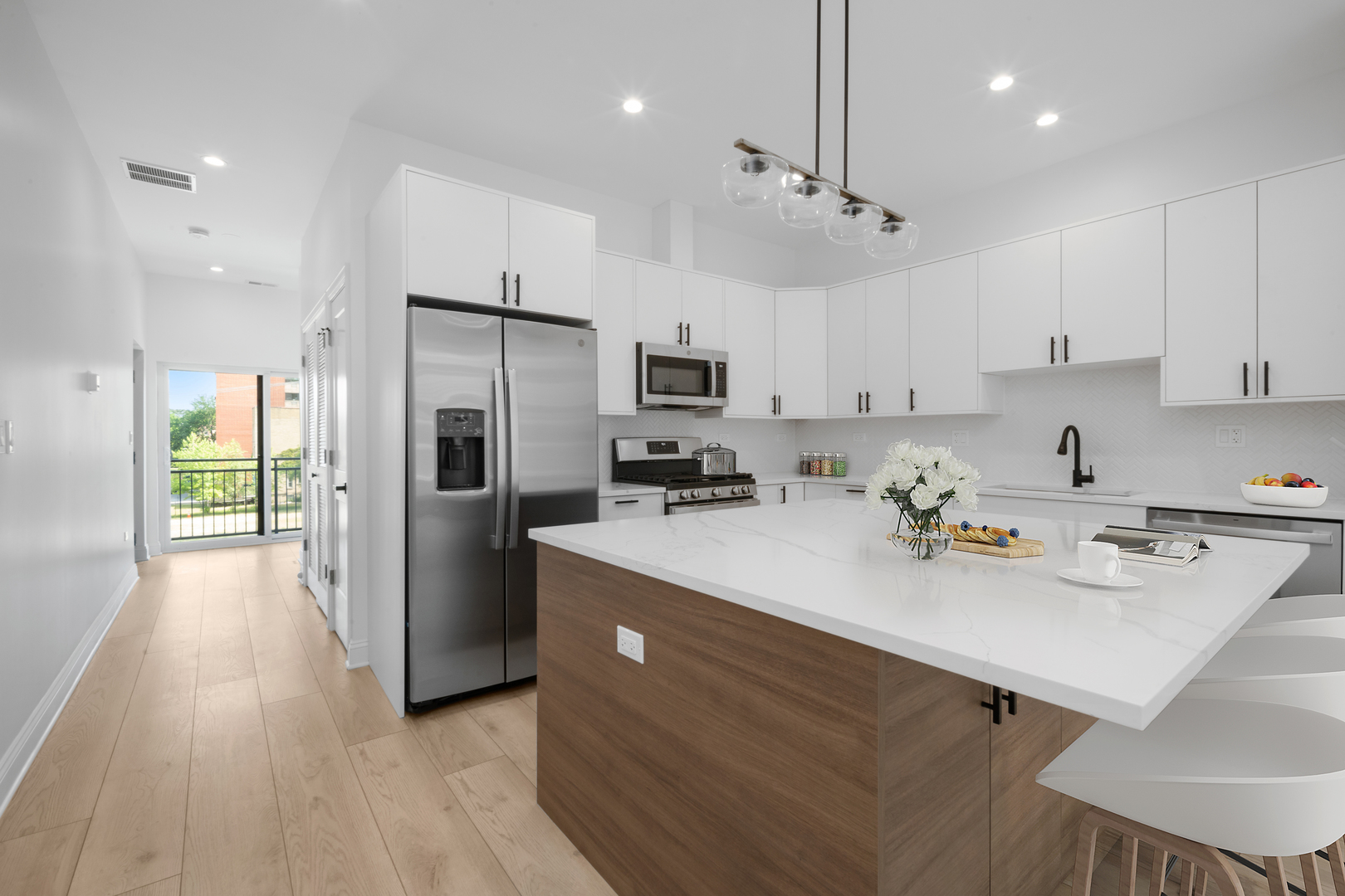 70 East Pershing Road, Unit 3E Chicago, IL 60653 - Photo 2 of 17 a kitchen with a sink a counter top stainless steel appliances and cabinets