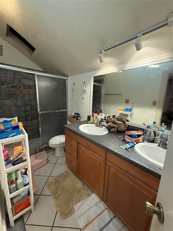 4507 Avenue F, Unit B Austin, TX 78751 - Photo 3 of 5 a bathroom with a sink mirror and shower