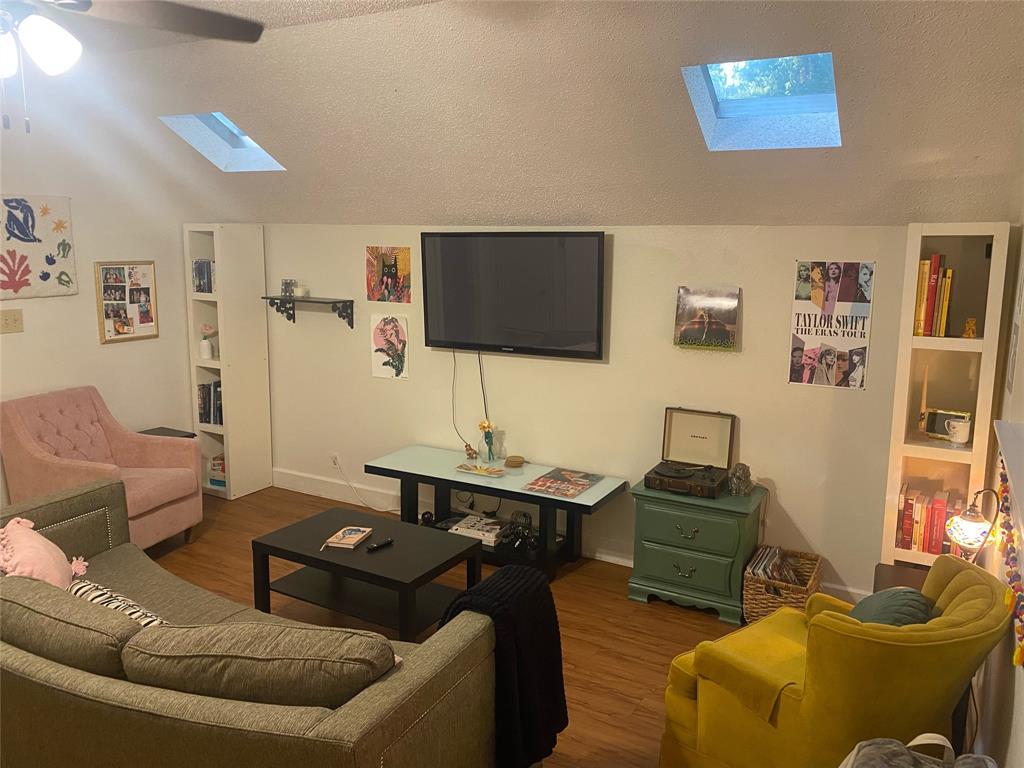 4507 Avenue F, Unit B Austin, TX 78751 - Photo 5 of 5 a living room with furniture and a flat screen tv