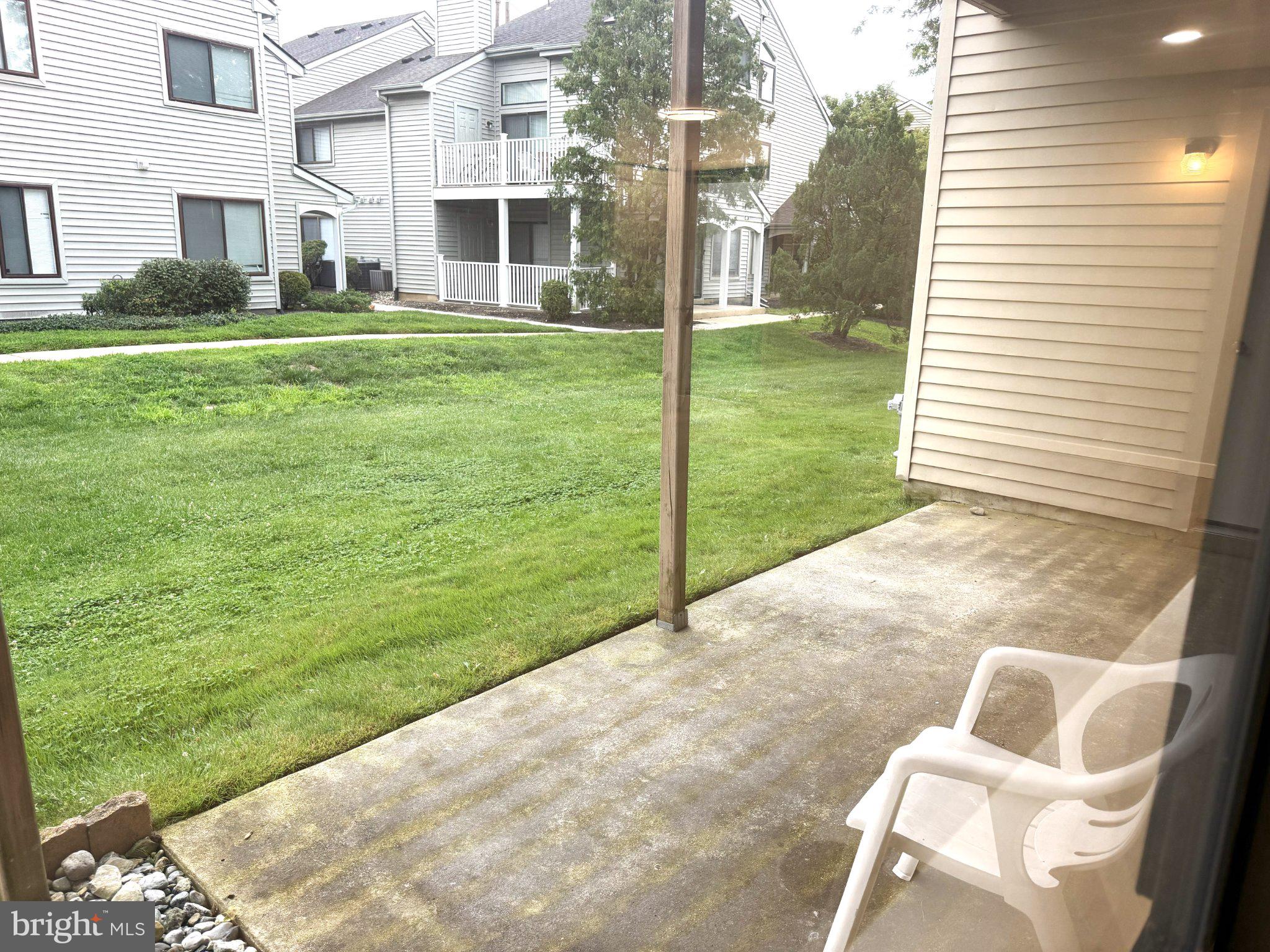 53 Sandra Road Voorhees, NJ 08043 - Photo 19 of 27 Serene patio view of lush greenery.