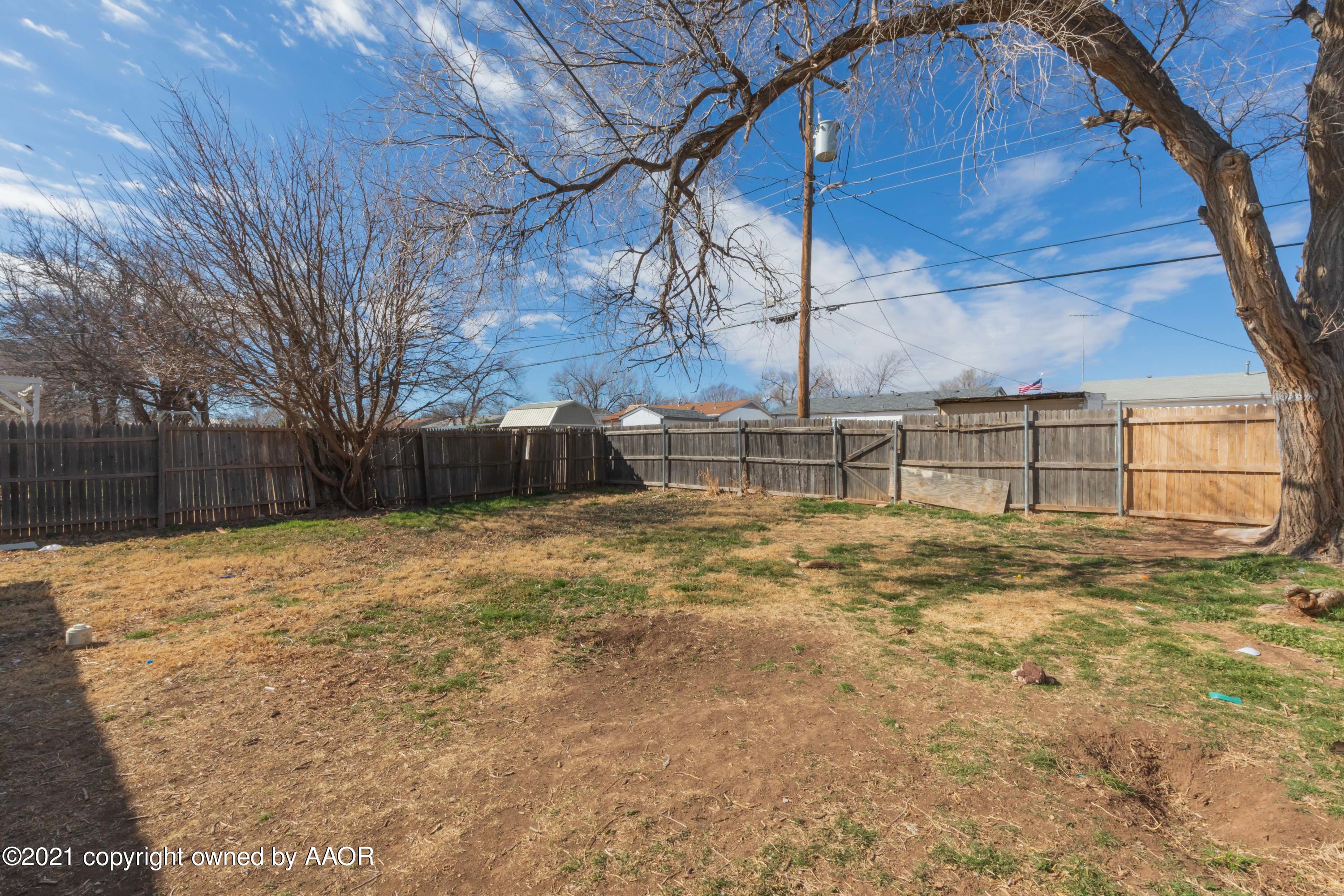 5102 South Travis Street Amarillo, TX 79110 - Photo 24 of 24 a view of backyard with wooden fence