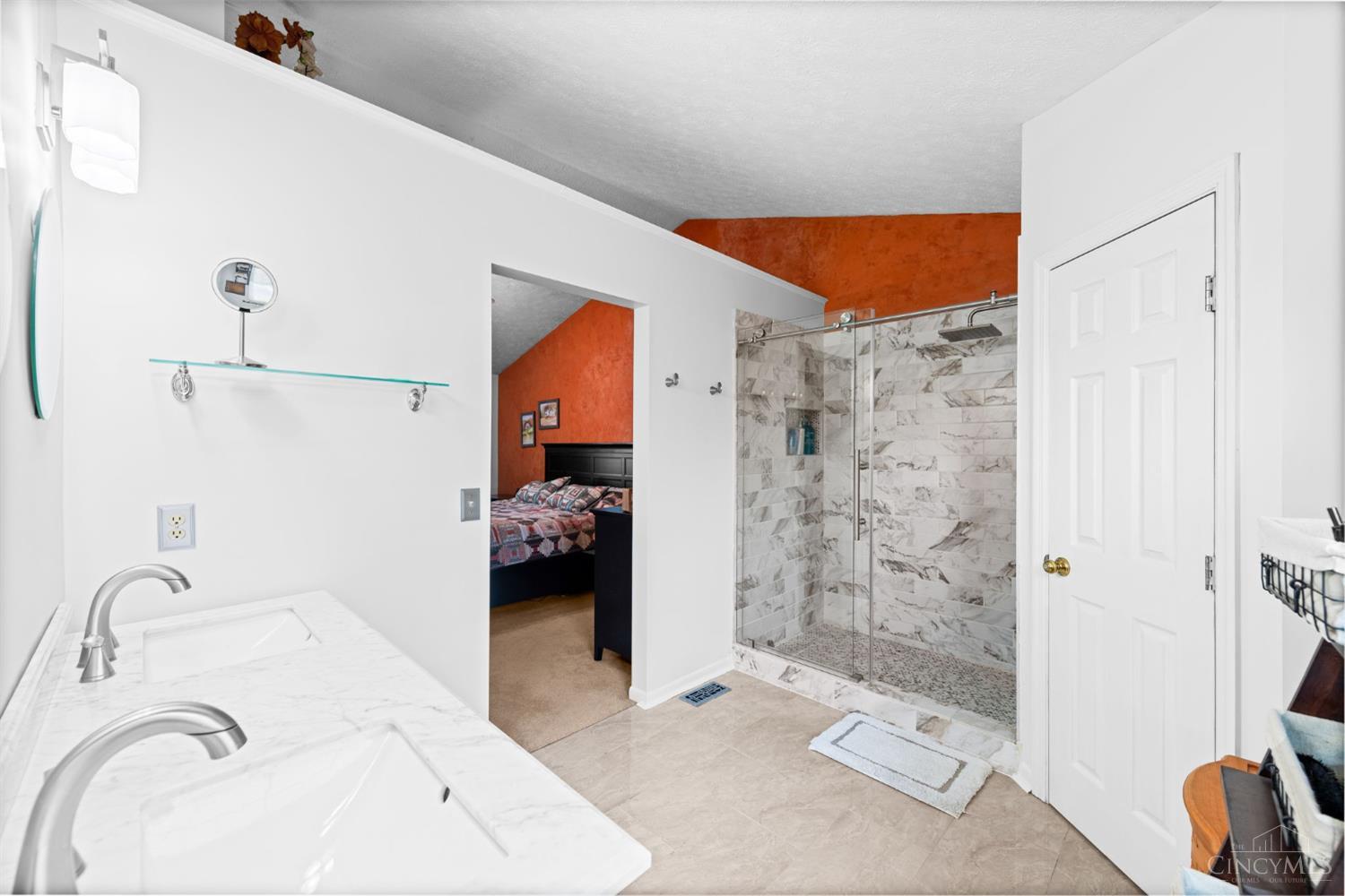 724 Regent Road Cincinnati, OH 45245 - Photo 31 of 67 Large tile floor, expansive shower fully tiled with new fixtures and door. Door to the right is to the toilet room for privacy. Toilet is updated and tall height.