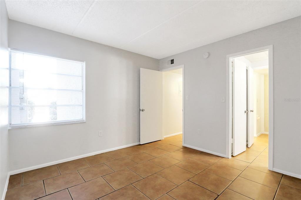 1902 Honour Road, Unit 11 Orlando, FL 32839 - Photo 14 of 18 a view of an empty room and window