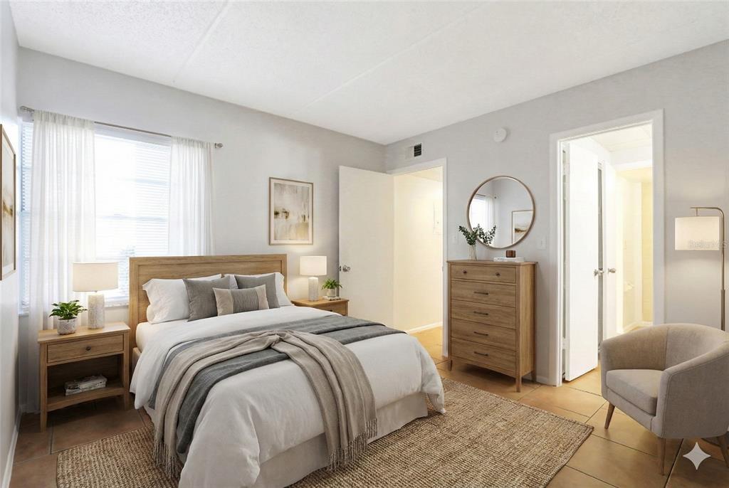 1902 Honour Road, Unit 11 Orlando, FL 32839 - Photo 15 of 18 a bedroom with a bed and window