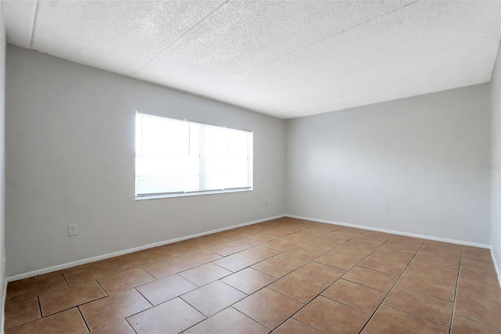 1902 Honour Road, Unit 11 Orlando, FL 32839 - Photo 16 of 18 an empty room with windows