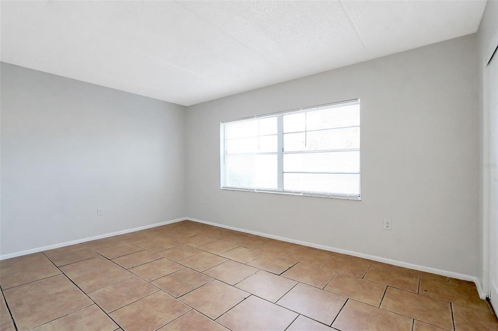 1902 Honour Road, Unit 11 Orlando, FL 32839 - Photo 17 of 18 an empty room with windows