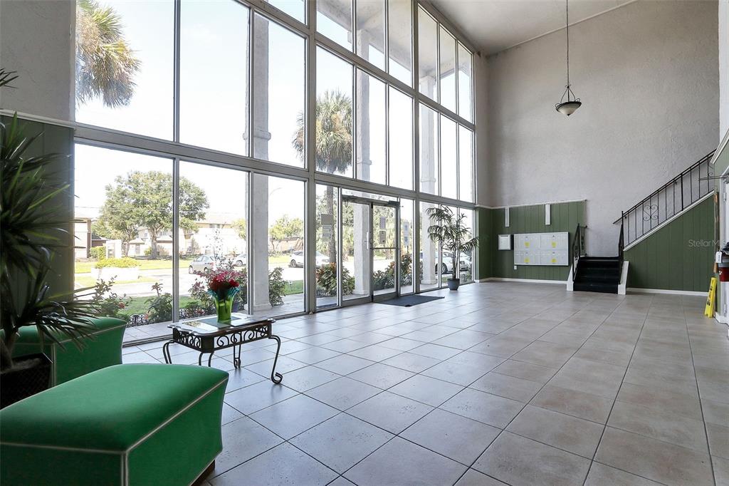 1902 Honour Road, Unit 11 Orlando, FL 32839 - Photo 2 of 18 a view of a livingroom with furniture and floor to ceiling window