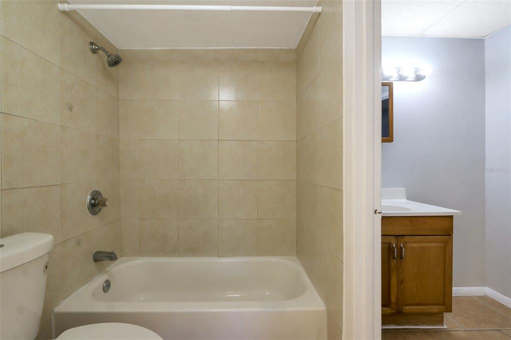 1902 Honour Road, Unit 11 Orlando, FL 32839 - Photo 10 of 18 a bathroom with a bathtub