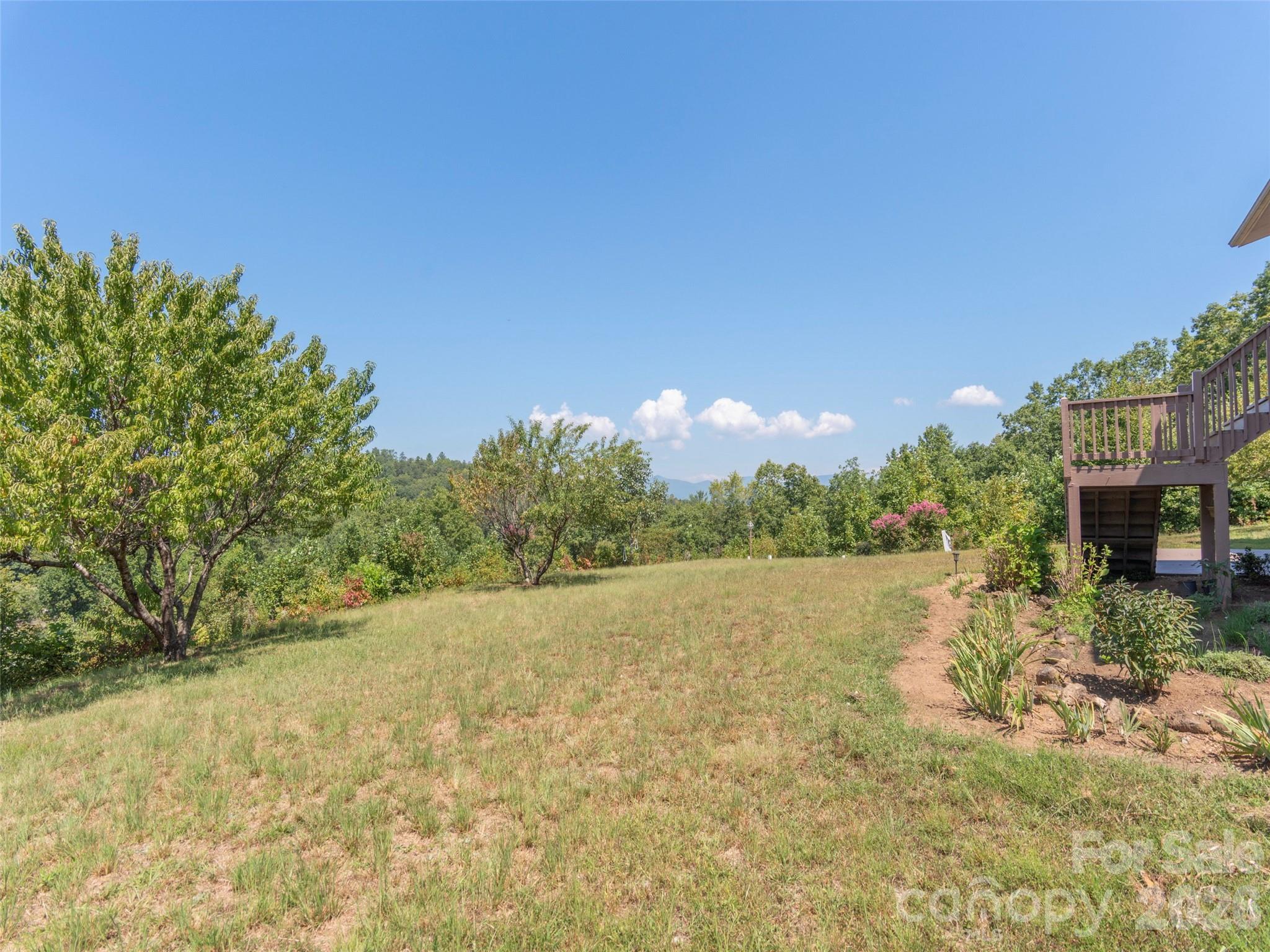1120 Jacobs Branch Road Franklin, NC 28734 - Photo 25 of 36 a view of a lake with a house in the background