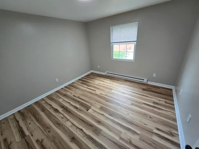 a view of an empty room and window