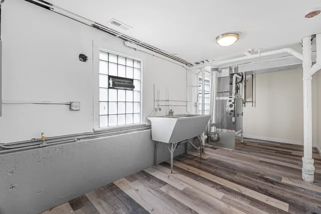 a front view of a house with a garden and yard