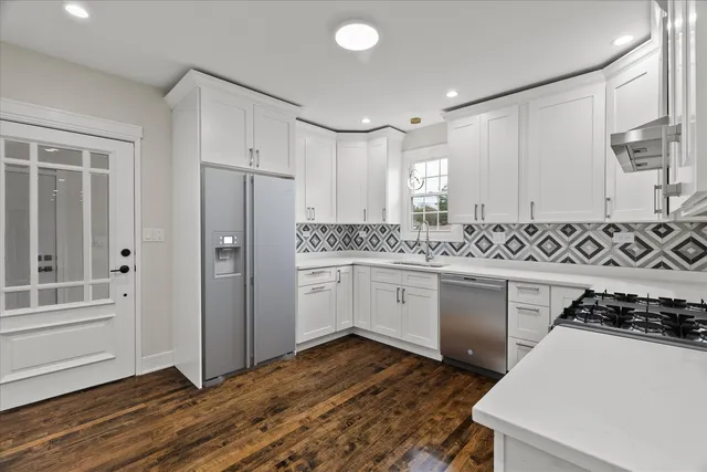 a kitchen with a sink a stove and refrigerator