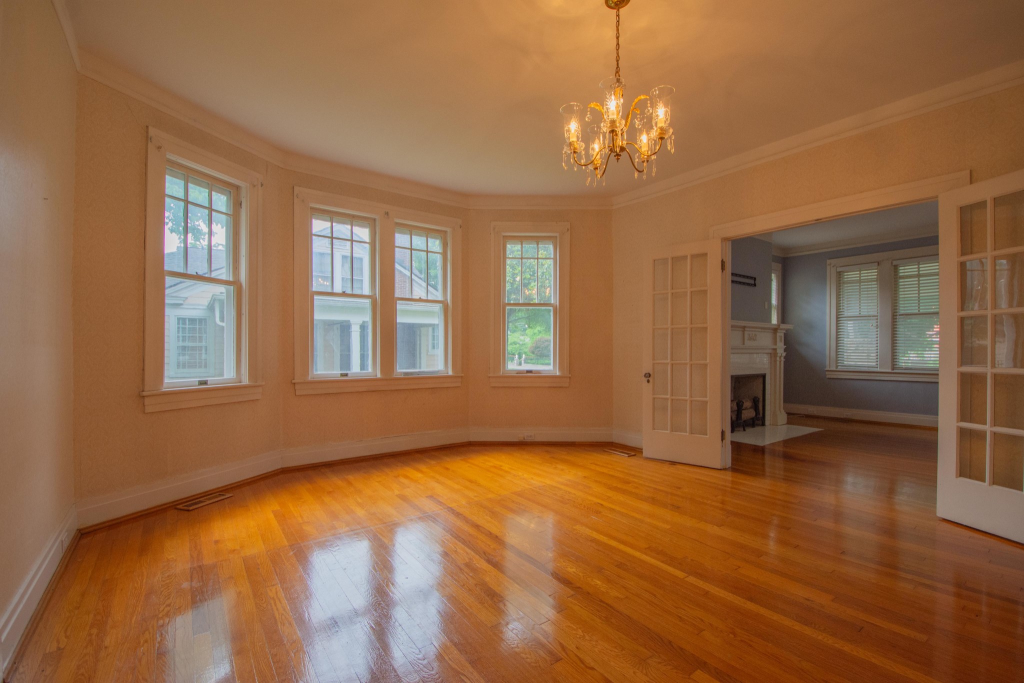 311 South 3rd Street Pulaski, TN 38478 - Photo 8 of 44 a view of an empty room with window and wooden floor