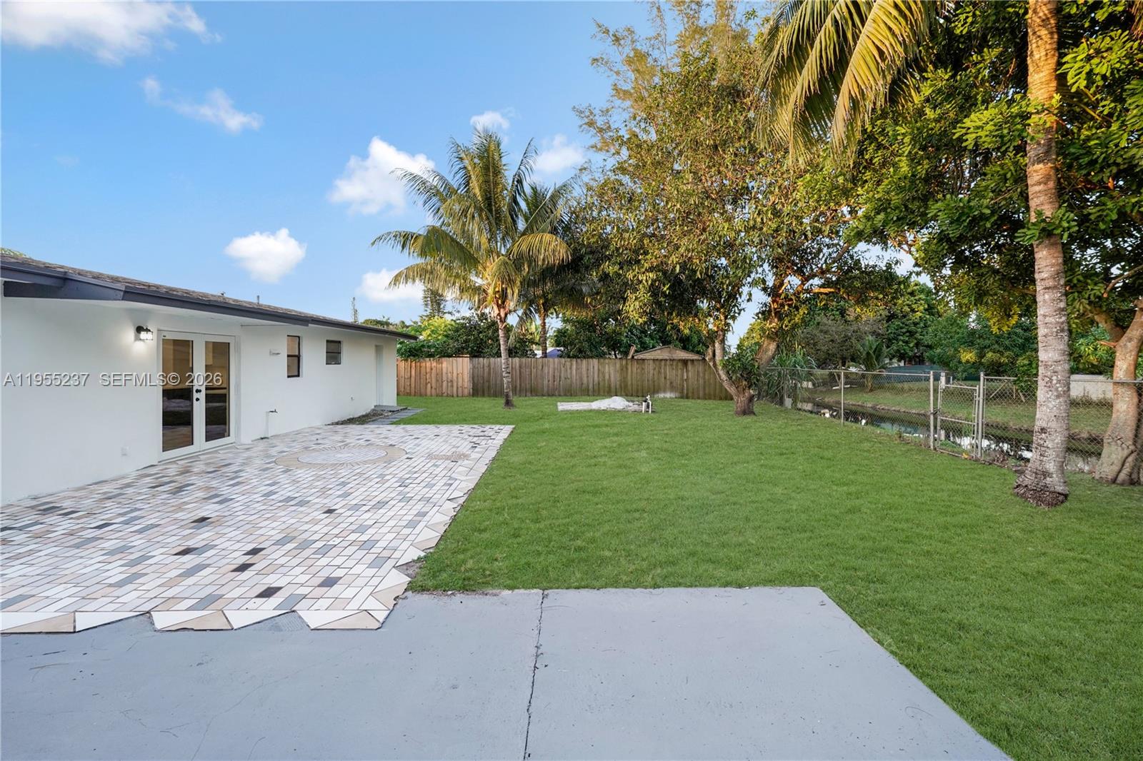 368 Southwest 64th Terrace Pompano Beach, FL 33068 - Photo 12 of 23 a view of a backyard with a garden