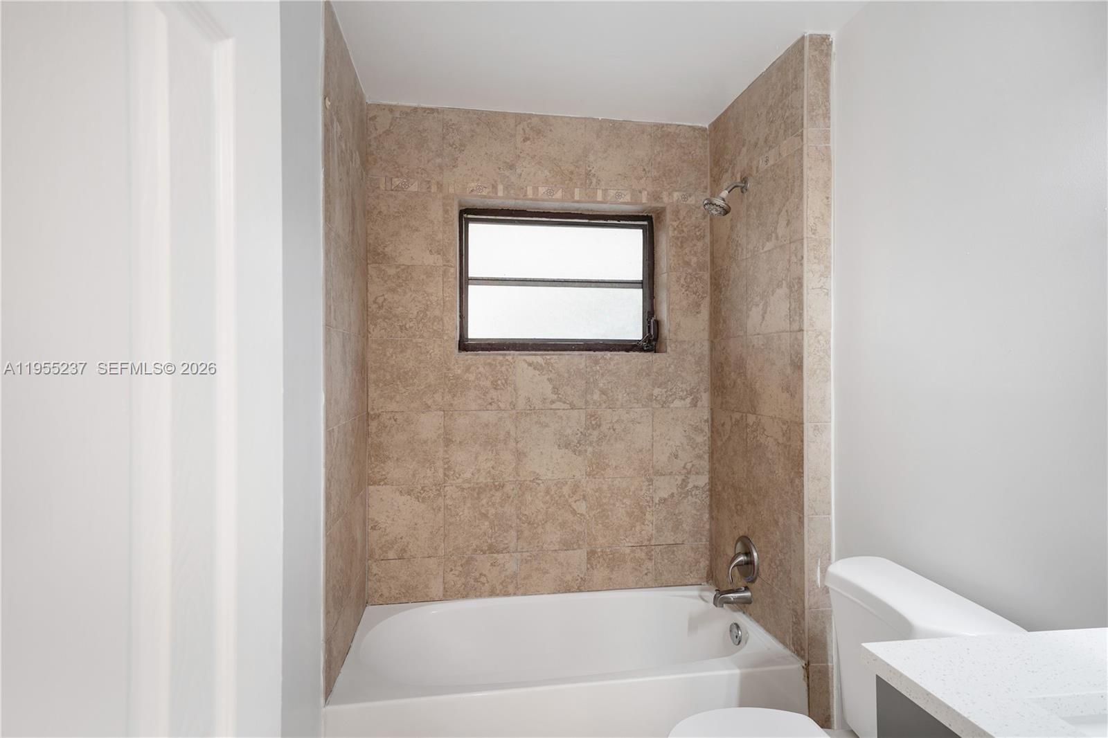 368 Southwest 64th Terrace Pompano Beach, FL 33068 - Photo 16 of 23 a bathroom with a bathtub and a shower