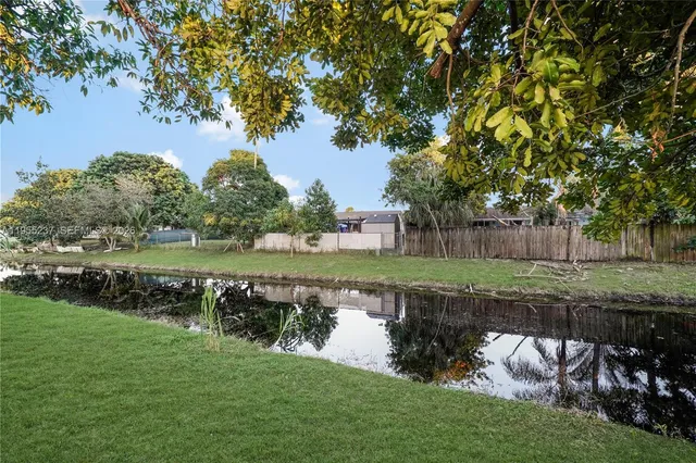 a view of a lake with a garden