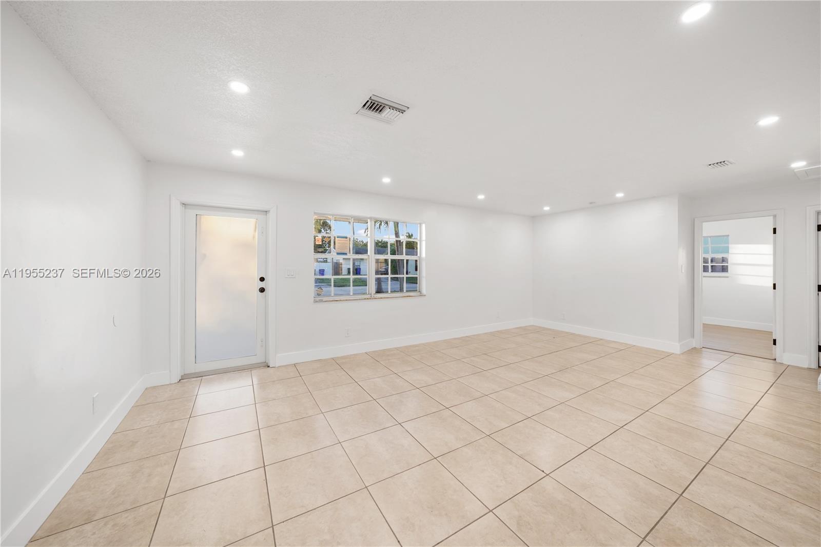 368 Southwest 64th Terrace Pompano Beach, FL 33068 - Photo 3 of 23 a view of an empty room and a window