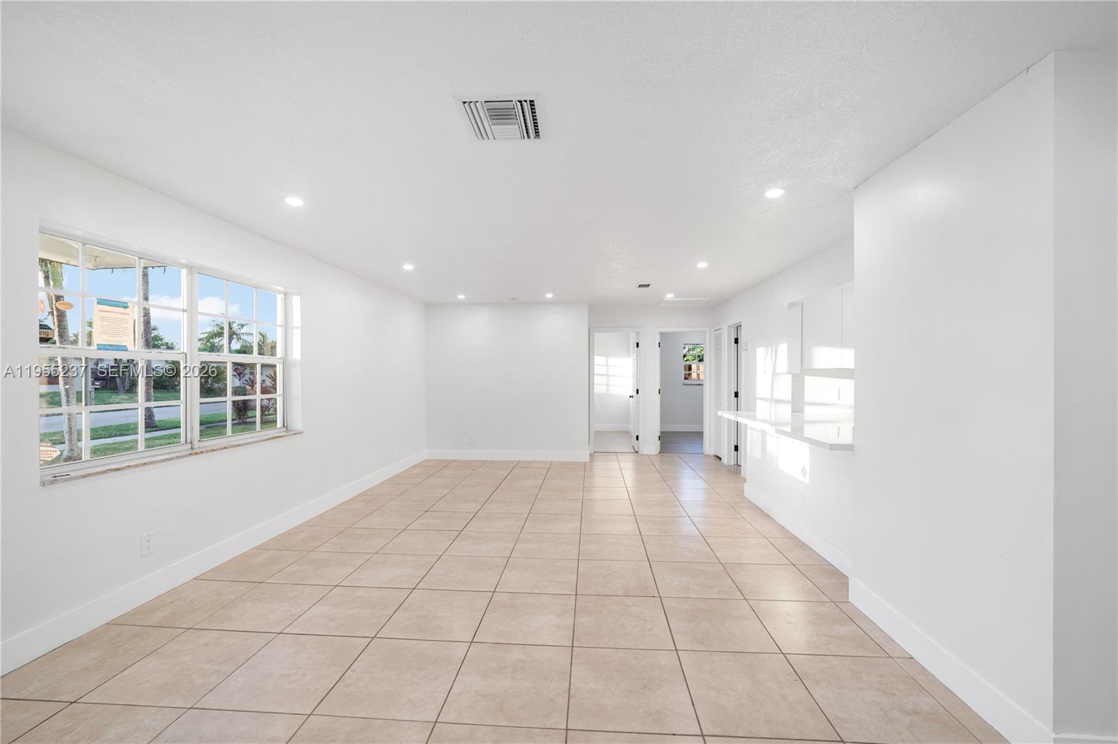 368 Southwest 64th Terrace Pompano Beach, FL 33068 - Photo 4 of 23 a view of an empty room with a window