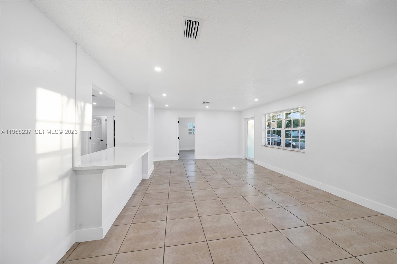 368 Southwest 64th Terrace Pompano Beach, FL 33068 - Photo 6 of 23 a view of an empty room and a window