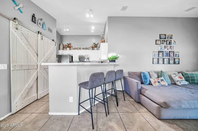 a living room with furniture and a window
