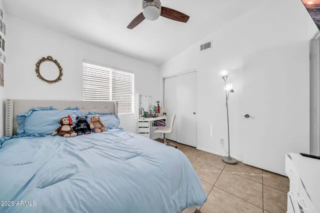 a bed room with a bed and a lamp