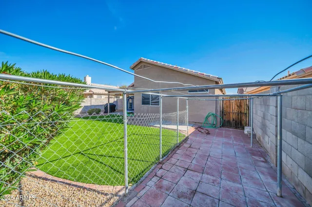 a view of a backyard with a small cabin
