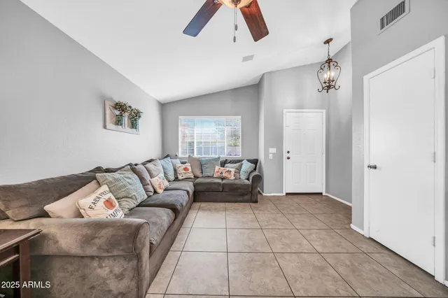 a living room with furniture and a rug