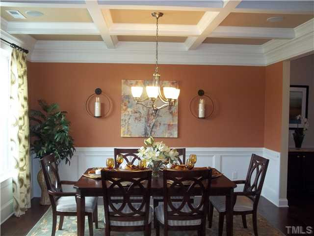 2201 Lower Lake Road Wake Forest, NC 27587 - Photo 5 of 25 Beautiful formal dining room features Hardwood floors, coffered ceiling, LOTS of trim 3 piece crown and wainscoting. Butlers pantry included between the formal dining room and kitchen. Dining Room