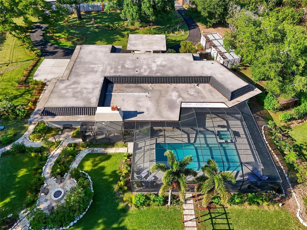 1875 Belleair Road Clearwater, FL 33764 - Photo 82 of 100 an aerial view of a house with yard swimming pool and outdoor seating