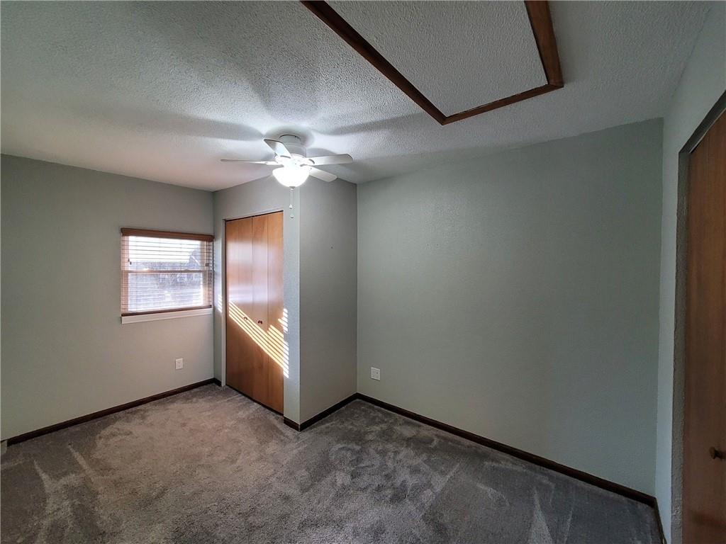 212 Summit Street Butler, PA 16001 - Photo 12 of 17 an empty room with chandelier fan and windows