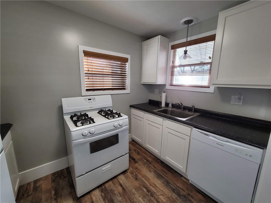 212 Summit Street Butler, PA 16001 - Photo 5 of 17 a kitchen with granite countertop white cabinets and white appliances
