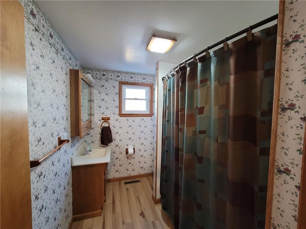 212 Summit Street Butler, PA 16001 - Photo 7 of 17 a bathroom with a shower and a mirror