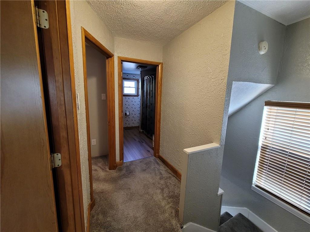 212 Summit Street Butler, PA 16001 - Photo 10 of 17 a view of a hallway with wooden shelves