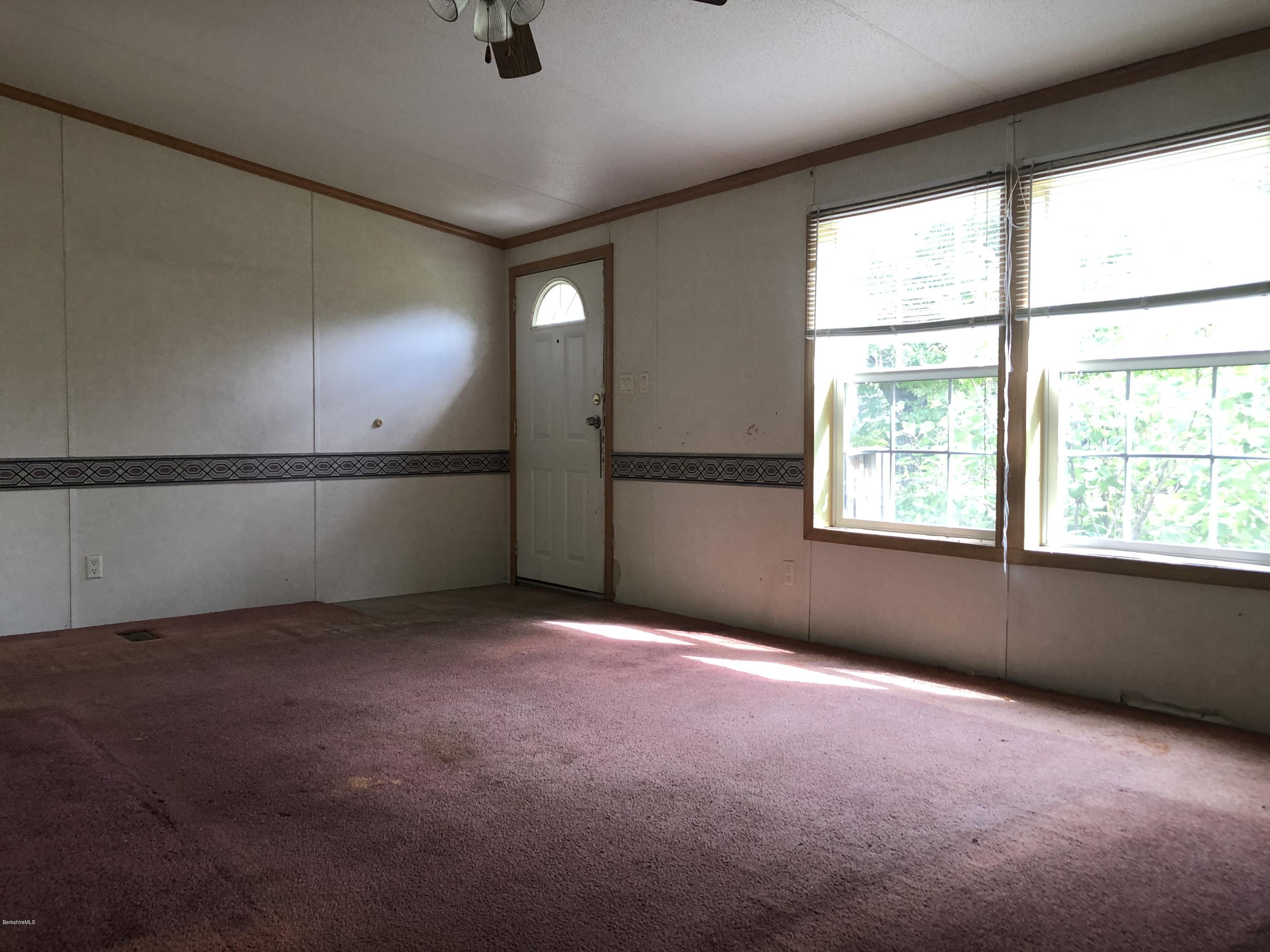 55 East Windsor Road Peru, MA 01235 - Photo 10 of 28 an empty room with windows and closet