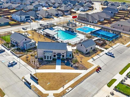 a aerial view of a house with a yard and plants