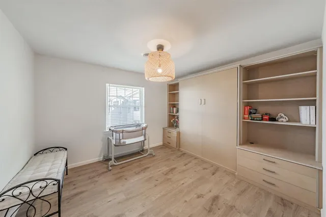 a view of a livingroom with wooden furniture